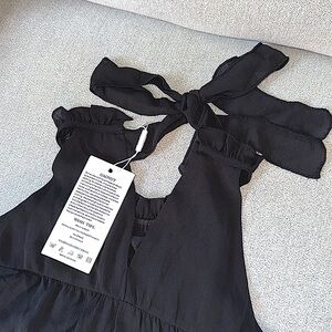 GAOVOT MULTI-TIERED DRESS.  RUFFLED NECKLINE WITH BACK BOW STRAPS.  BLACK. S